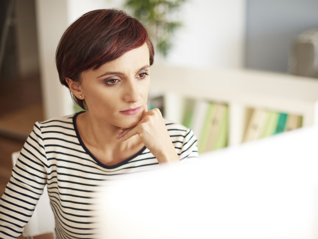 Woman Looking At Monitor Screen